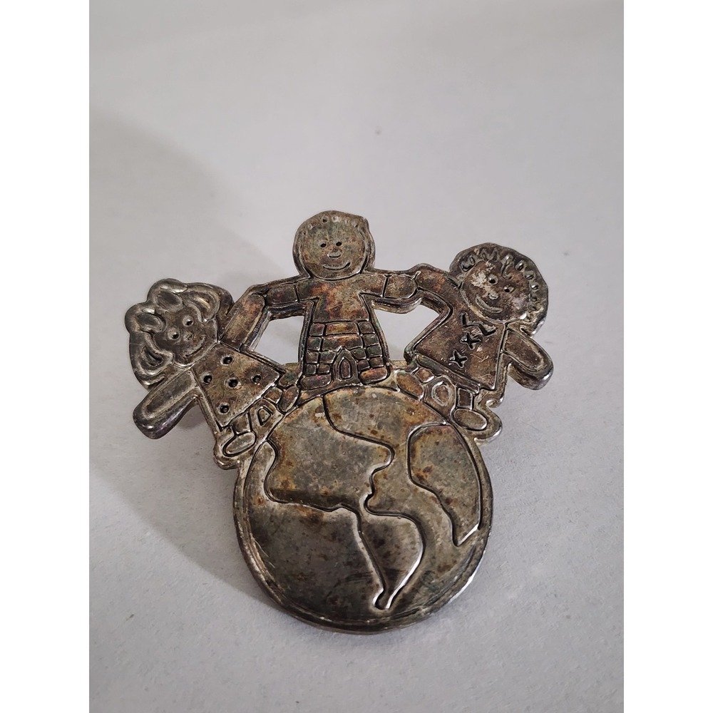 Vintage Silver Tone Children Holding Hands World Globe Brooch Pendant MJ Logo